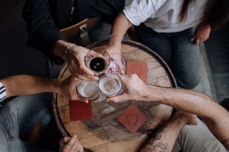 Guys Enjoying Their Time Over Beer.
