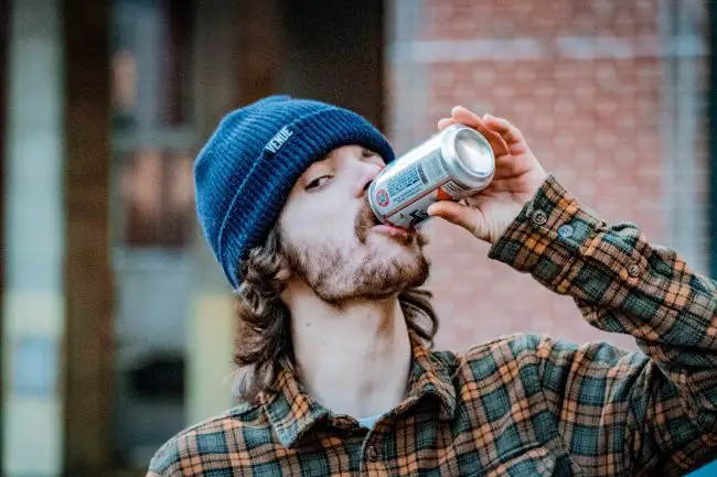 Enjoying A Can Of Beer.