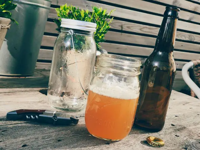 Glass Mason Jars, Bottles And A Bottle Opener.