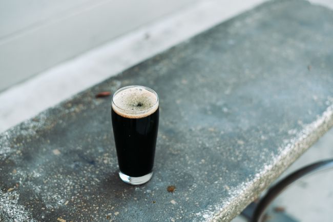 A Glass Of Stout On A Bench.