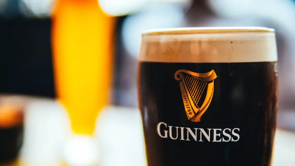 A Glass Of Frothy Guinness Stout.