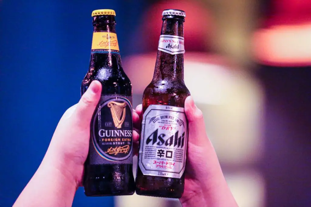A Guinness Stout And Dry Asahi Chilled Bottles.