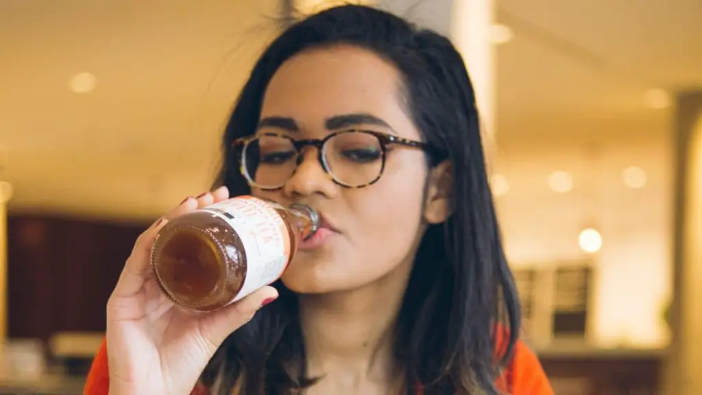 A Lady Enjoying A Hard Seltzer Drink.